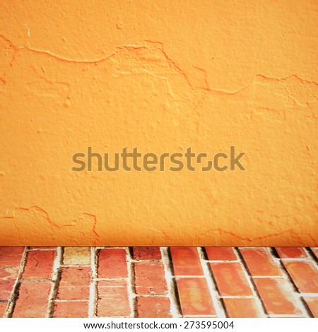 room interior vintage with brick wall and cement orange floor background