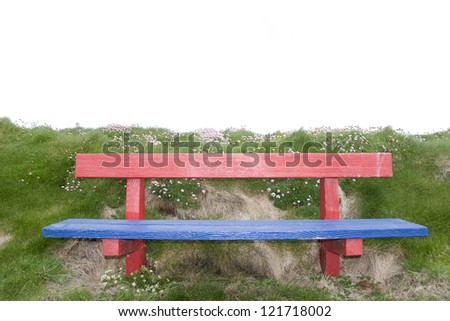 red and blue bench positioned at the edge on top of a cliff