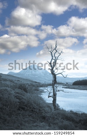 view of the Errigal mountains and countryside in county Donegal, Ireland in blue tone