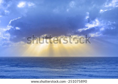 sun rays streaming through the storm clouds on the Irish wild Atlantic way