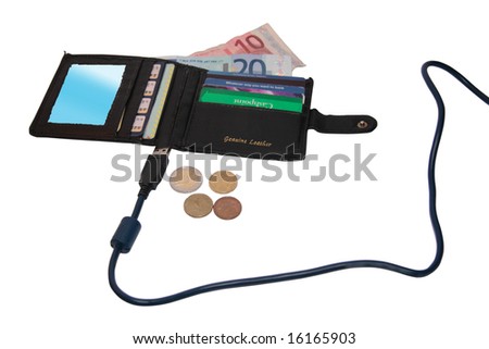 some credit cards (made up fake cards ) and coins in the background with a lead representing on line banking from past to future with clipping path