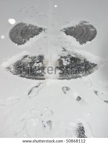 a snow angel on the road surface