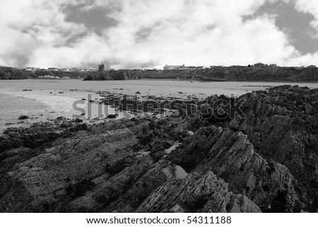 a rocky beach on a warm day with a calm sea an ideal place to have a walk in ireland