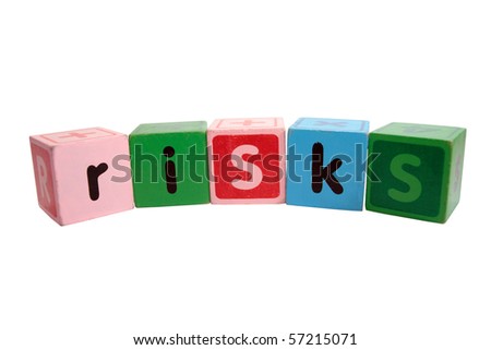 assorted children toy letter building blocks against a white background that spell risks