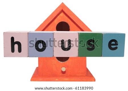 toy letters that spell house against a birdhouse with clipping path