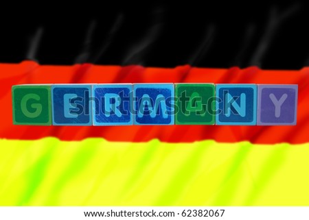 toy letters that spell germany against a flag background with clipping path