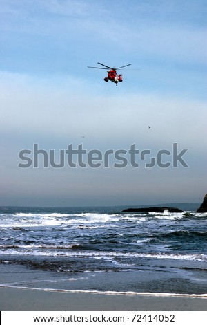 BALLYBUNION,IRELAND-MARCH 2: Irish sea rescue helicopter searches for missing person near cliffs on March 2,2011 in Ballybunion, county Kerry, Ireland. The cliffs are often used in suicide attempts.