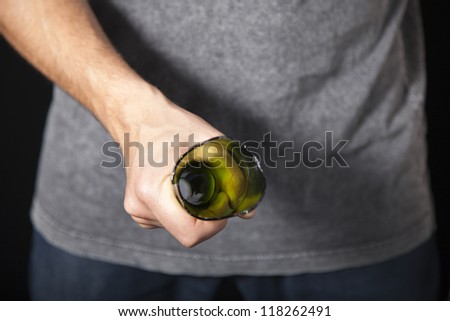 Man threatening with broken beer bottle as weapon