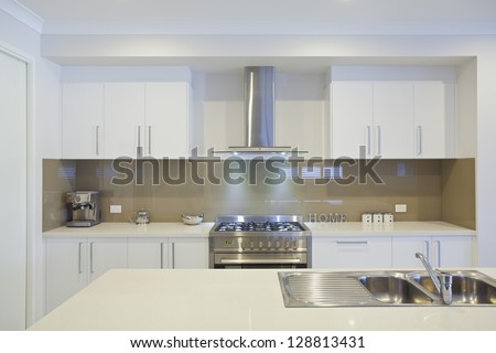 New modern kitchen with stainless steel appliances New modern kitchen with stainless steel appliances