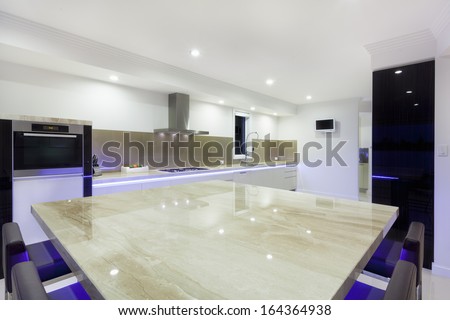 Luxurious new kitchen with LED lights and modern appliances