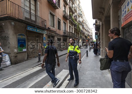 BARCELONA, SPAIN - JULY 29: Shooting in Barcelona\'s La Rambla leaves several people injured on July 29, 2015 in Barcelona, Spain. La Rambla is a bustling thoroughfare, which is popular with tourists.