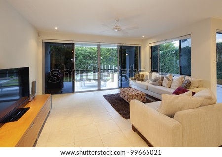 Stylish Living Room With Couch And Tv In Modern House Stock Photo ...