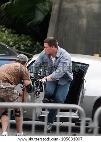 NEW ORLEANS-MAR. 19:Professional wrestler and actor John Cena jumps from a car during the filming of the movie 