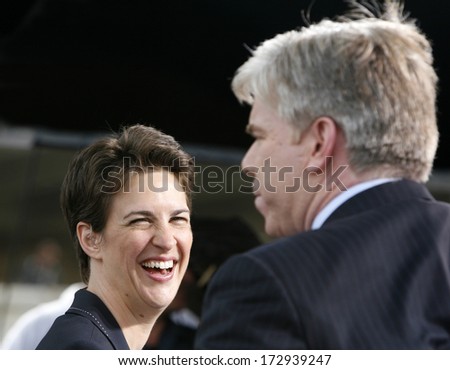 DENVER-AUG. 25:MSNBC TV pundits Rachel Maddow laughs with David Gregory during a live broadcast from the 2008 Democratic National Convention on August 25, 2008.
