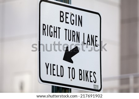 Right turn lane yield to bikes sign.