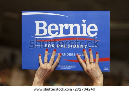 MADISON, WI/USA - July 1, 2015: A woman holds up a Bernie Sanders for President sign during a rally of over 10,000 people for Bernie Sanders in Madison, Wisconsin.