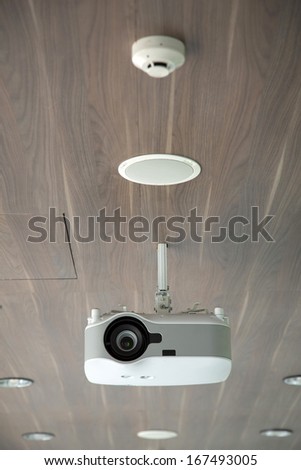 Projector hang on wooden ceiling