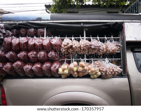 Truck vegetable shop,Vegetable in plastic bag hanging around truck