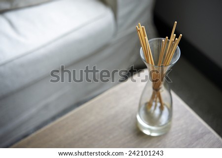 Scent sticks aromatic in jar on table
