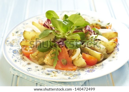 Potato salad with smoked sea bass and salted salmon