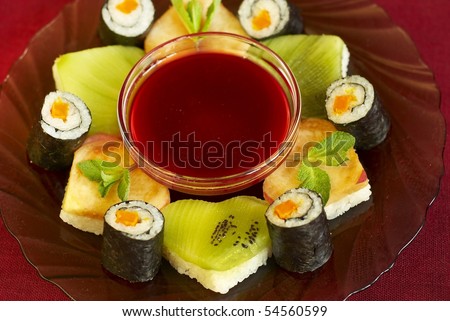 Vegetarian dessert sushi with kiwi, peach and carrot