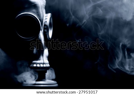 Gas mask with smoky background isolated on black