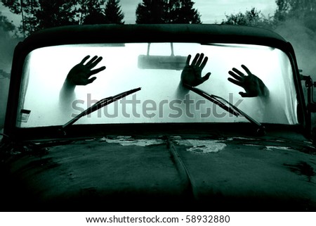 silhouettes of passengers in car full of smoke