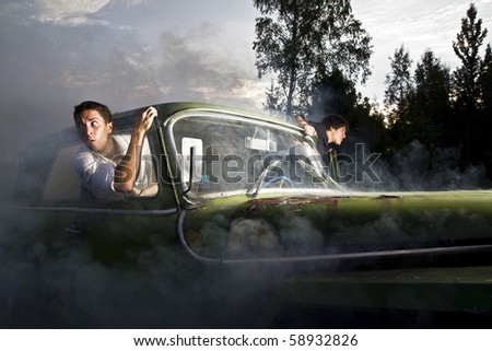 guys and car full of smoke