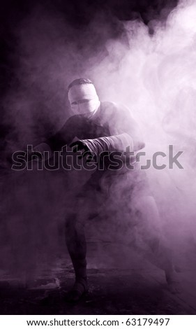 Big man in abstract smoke