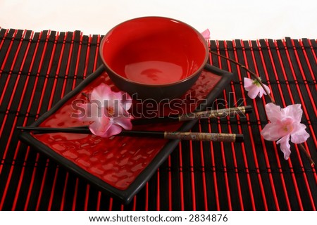 Chinese sticks, red plate and red cup