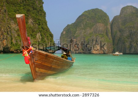 Colourfully decorated boat at Maya Bay: an idyllic beach on Phi Phi Ley - the scene of the film \