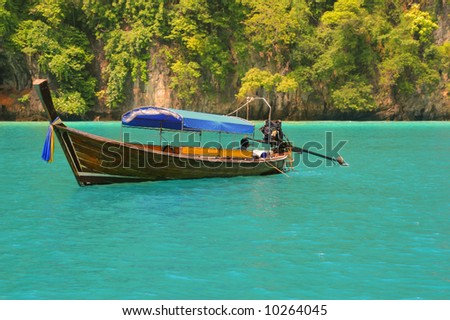 Colourfully decorated boat at Maya Bay: an idyllic beach on Phi Phi Ley - the scene of the film \