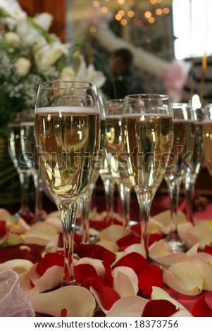 stock photo wedding table setting Champagne rose petals