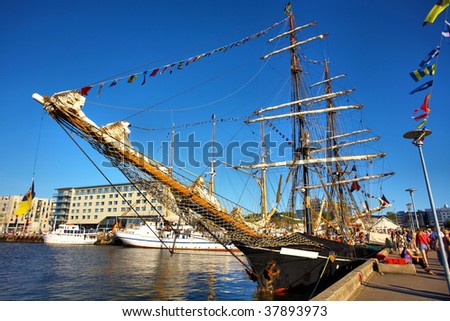 A tall ship (sailing ship), Vintage Frigate - with a clear blue sky in the background