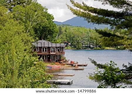 Beautiful house on the water side surrounded by trees