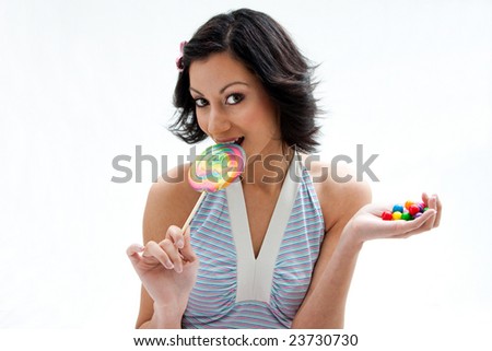  beautiful candy girl with a hand full of colorful bubblegum candy balls