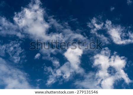 Background image of clouds on a sunny day with deep blue sky, noon