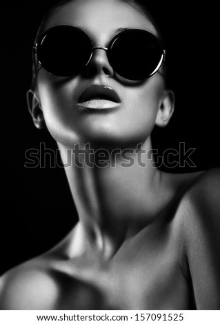 High Fashion Look.Glamor Closeup Portrait Of Beautiful Sexy Stylish Mode In Sun Glasses With Perfect Clean Skin In Studio