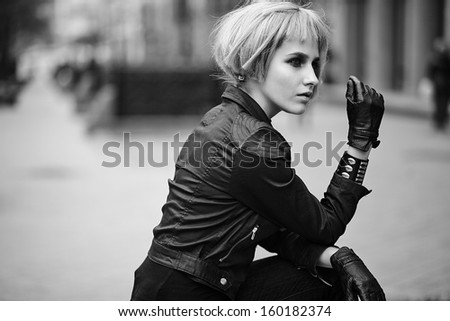 Fashion blond model in teenager style in wig outdoors on the street