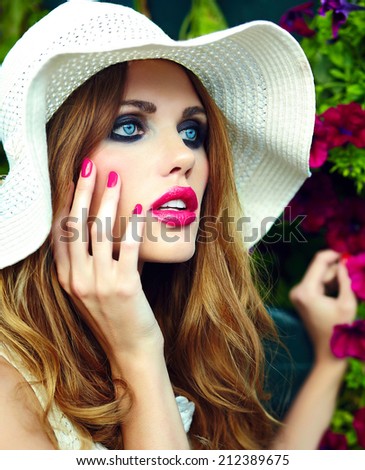 High fashion look.glamor closeup portrait of beautiful sexy stylish blond young woman model with bright makeup and pink lips with perfect clean skin in hat blue eyes