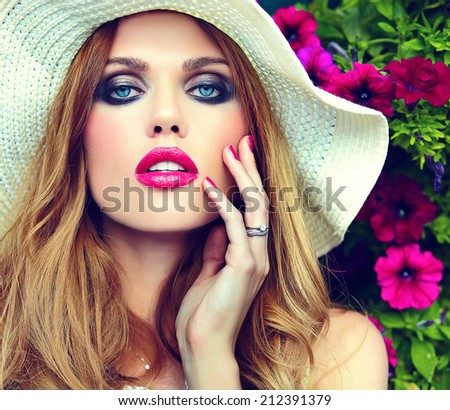 High fashion look.glamor closeup portrait of beautiful sexy stylish blond young woman model with bright makeup and pink lips with perfect clean skin in hat blue eyes