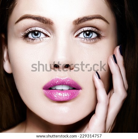 High fashion look.glamor closeup beauty portrait of beautiful   Caucasian young woman model with nude makeup   with perfect clean skin with colorful pink lips
