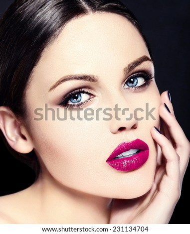 High fashion look.glamor closeup beauty portrait of beautiful   Caucasian young woman model with bright makeup   with perfect clean skin with colorful pink lips