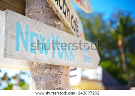 traffic road  sign including of New York on green tropical  background