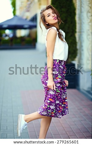 High fashion look.glamor stylish sexy smiling beautiful sensual young woman model in summer bright hipster cloth in the street
