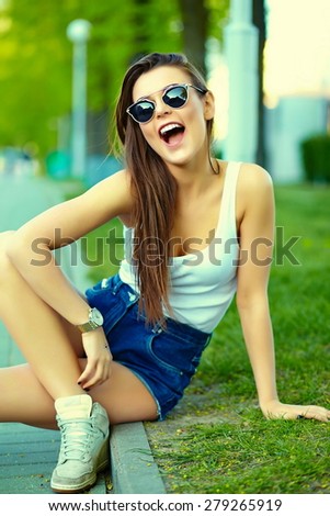 High fashion look.glamor stylish sexy smiling beautiful young woman model in summer bright hipster cloth in the street