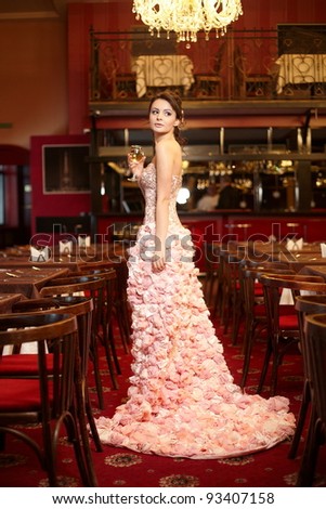 stock photo Beautiful bride in unusual wedding dress in the restaurant 