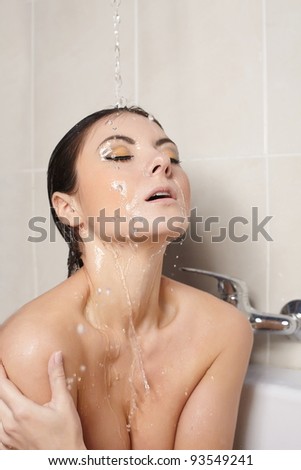 profile of beautiful girl taking shower - close-up portrait in the bath