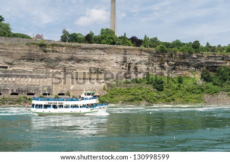 NIAGARA FALLS, CANADA - JULY 7: Maid of the Mist boat tour on July 7, 2012 in Niagara Falls, Canada. The Maid of the Mist is a boat tour of Niagara Falls.