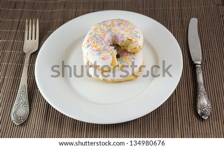 Donut with chunk bitten off